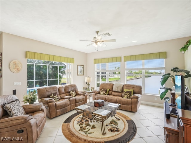 living room featuring ceiling fan and light tile patterned flooring