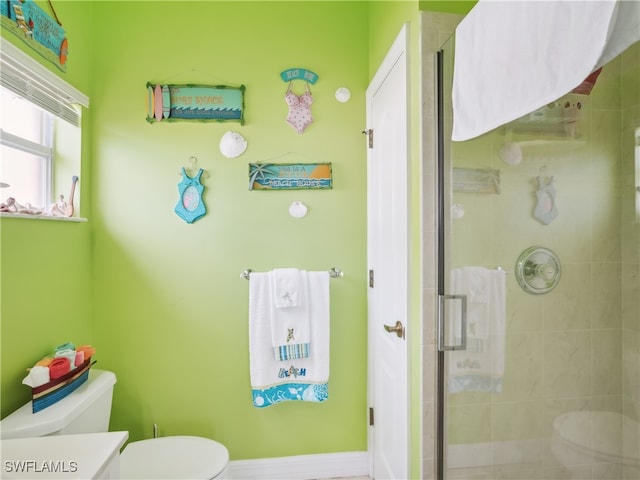 bathroom with vanity, toilet, and an enclosed shower