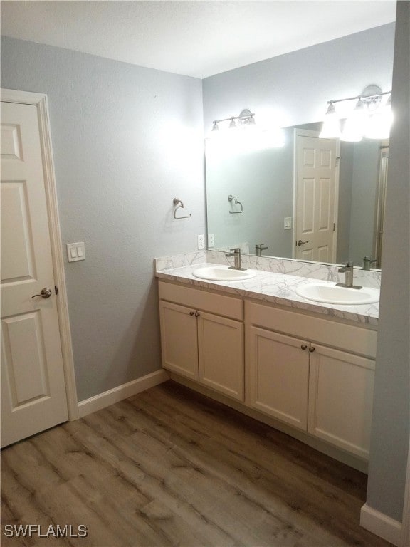 bathroom with vanity and hardwood / wood-style flooring