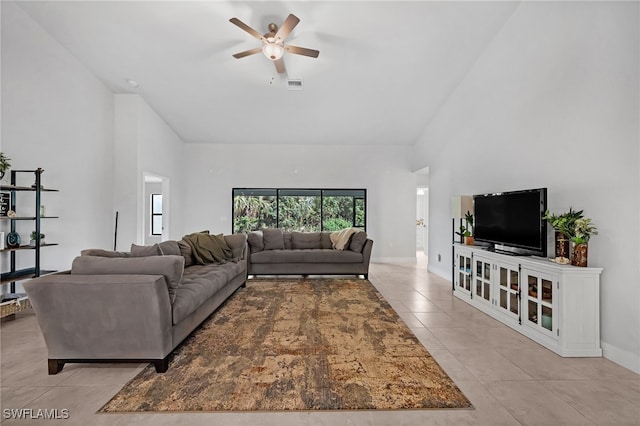 living room featuring light tile patterned floors, high vaulted ceiling, and ceiling fan