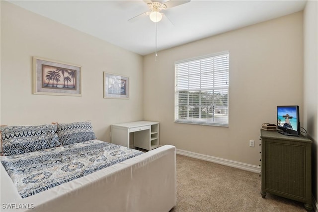 bedroom with light colored carpet and ceiling fan