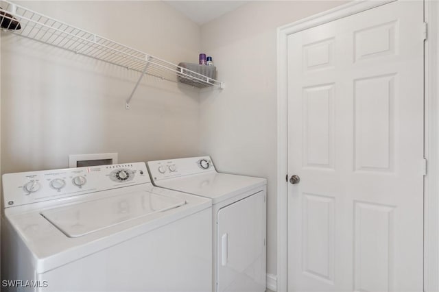 laundry room with washer and dryer