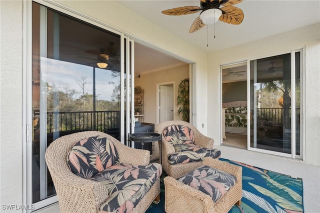 sunroom with ceiling fan and a wealth of natural light