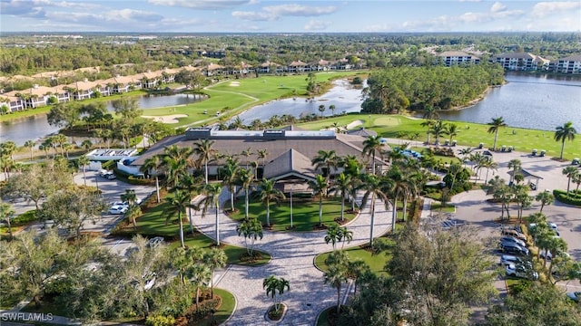 drone / aerial view with a water view and golf course view