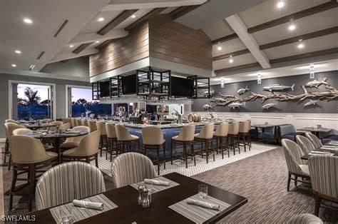 dining area with carpet and a high ceiling