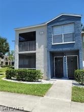 view of front of property with a balcony