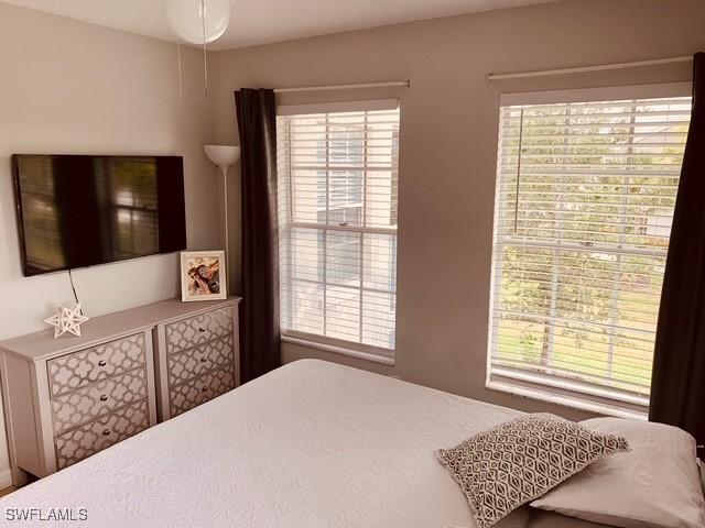 bedroom with multiple windows