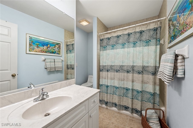 bathroom featuring tile patterned flooring, vanity, toilet, and a shower with curtain