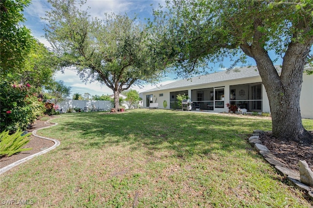 view of yard featuring a sunroom