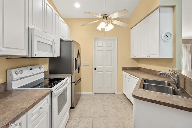 kitchen with white appliances, sink, ceiling fan, light tile patterned floors, and white cabinetry