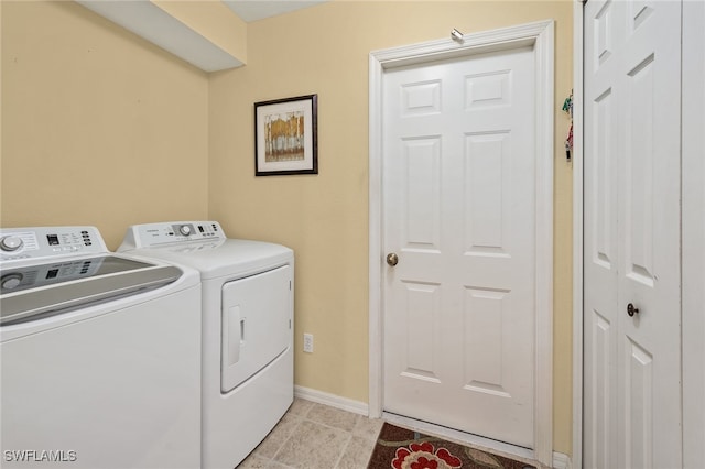 clothes washing area featuring independent washer and dryer