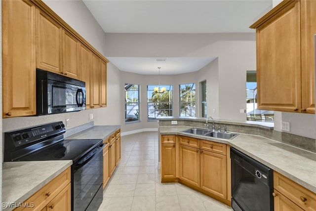 kitchen featuring a chandelier, sink, light tile patterned floors, and black appliances