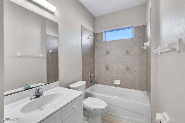 full bathroom with toilet, tile patterned flooring, vanity, and tiled shower / bath