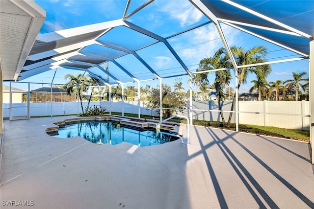 view of pool with a lanai and a patio area