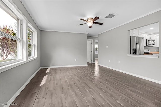 unfurnished living room featuring ceiling fan, light hardwood / wood-style flooring, and crown molding