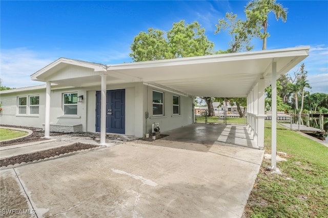 view of front of property featuring a carport