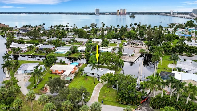 birds eye view of property with a water view