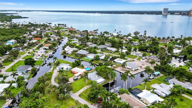 birds eye view of property featuring a water view