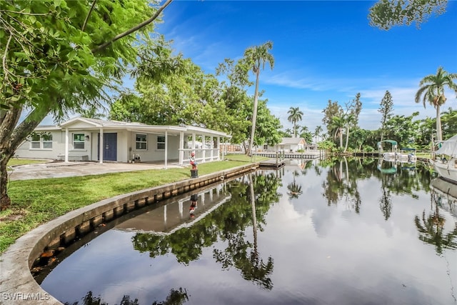 exterior space with a yard and a water view