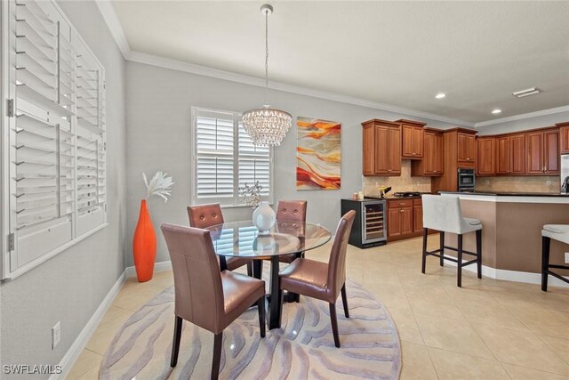 dining room with light tile patterned floors, wine cooler, crown molding, and a notable chandelier