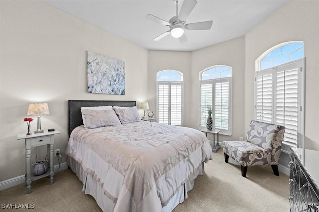 bedroom with light carpet and ceiling fan