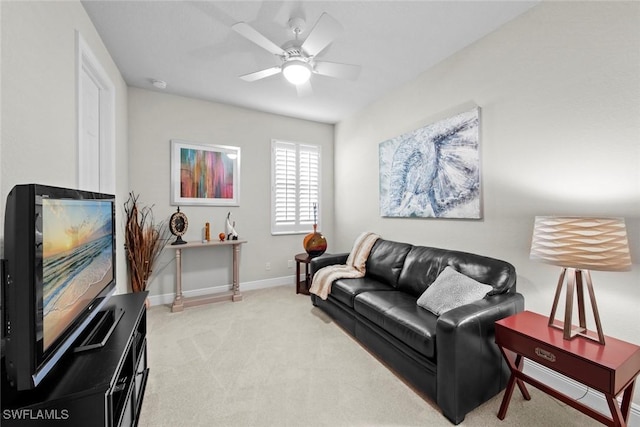 carpeted living room featuring ceiling fan