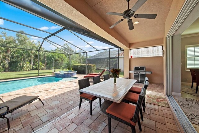 view of patio featuring ceiling fan, a pool with hot tub, grilling area, and glass enclosure