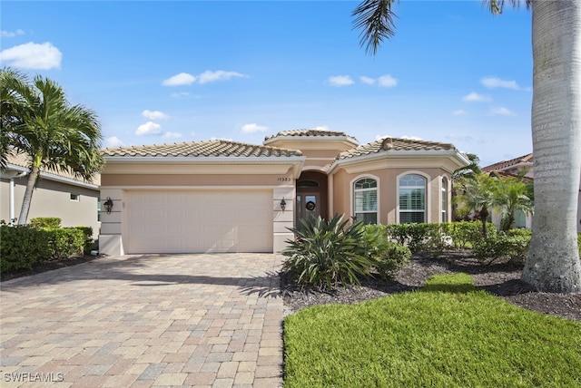 mediterranean / spanish-style home featuring a garage