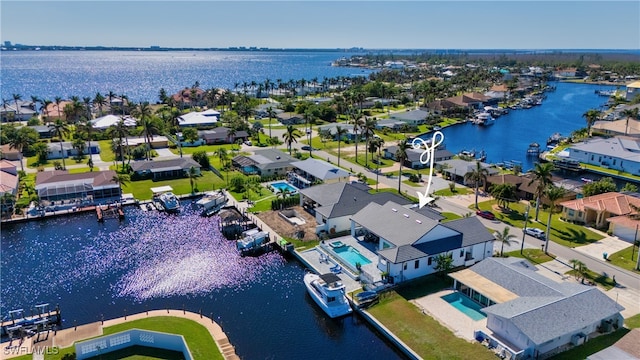 drone / aerial view with a water view