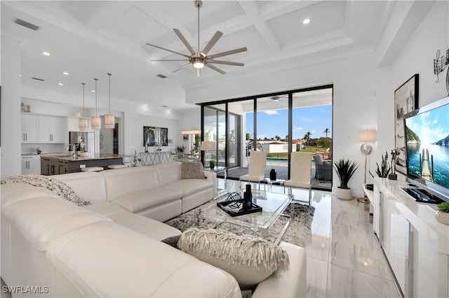 living room with coffered ceiling, crown molding, sink, ceiling fan, and beam ceiling