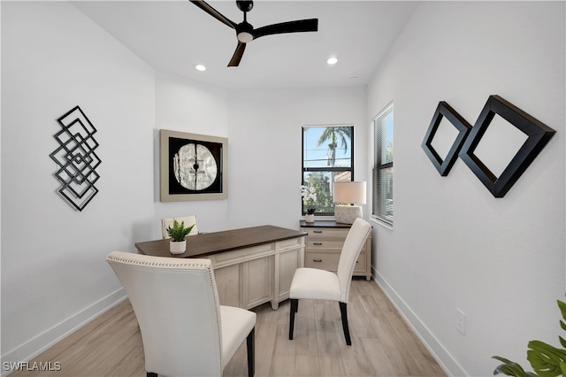 home office with ceiling fan and light hardwood / wood-style floors