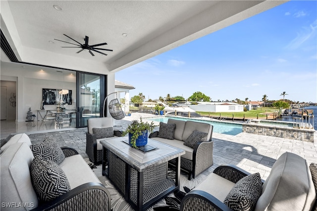 view of patio featuring an outdoor living space and a water view