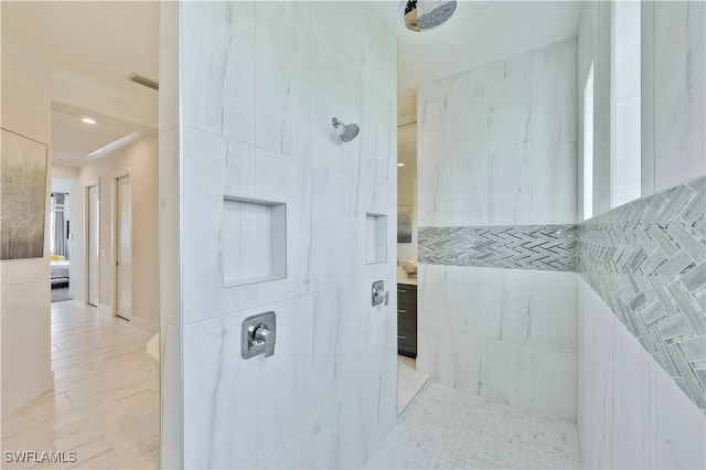 bathroom featuring walk in shower and tile walls