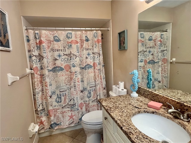 bathroom with tile patterned flooring, vanity, a shower with shower curtain, and toilet