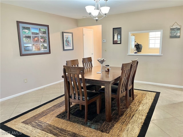 tiled dining area with an inviting chandelier