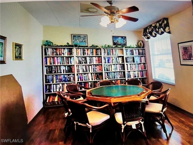 game room with ceiling fan and dark hardwood / wood-style flooring