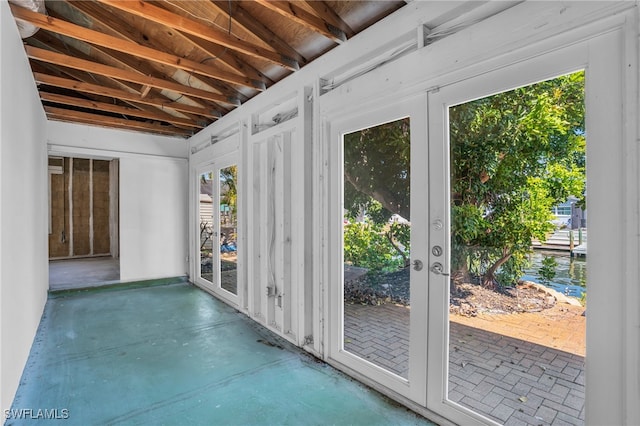 doorway featuring french doors and concrete floors