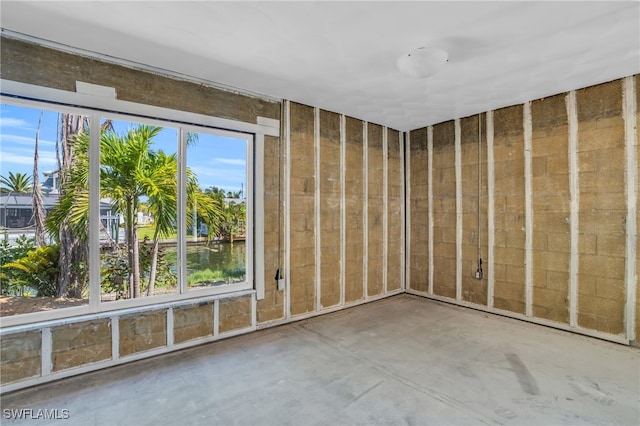 spare room with concrete floors