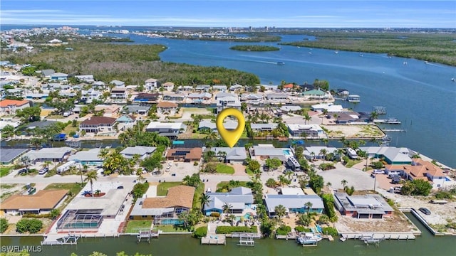 aerial view with a residential view and a water view