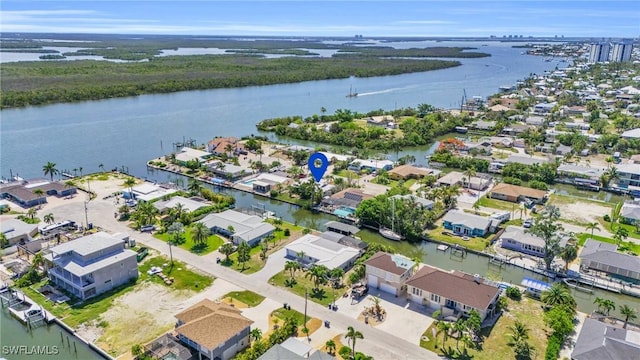 bird's eye view featuring a water view and a residential view