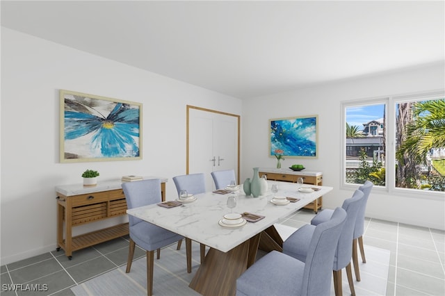 dining space featuring tile patterned floors