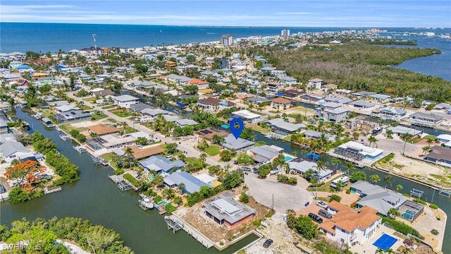 bird's eye view featuring a water view and a residential view