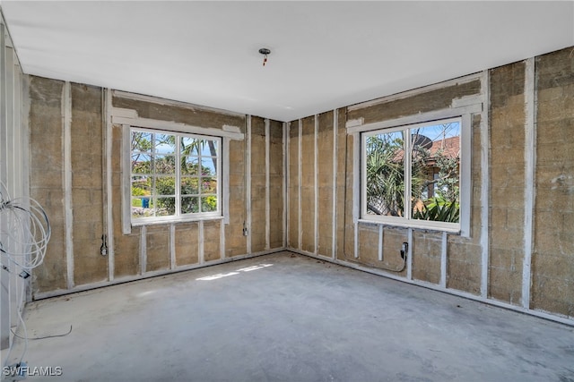 misc room featuring plenty of natural light and concrete floors