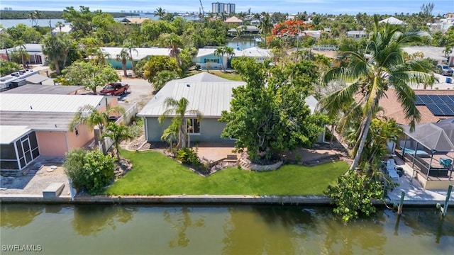 aerial view featuring a water view and a residential view