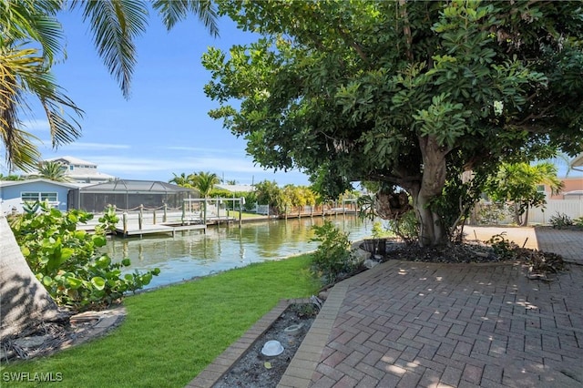 view of patio / terrace featuring a water view and a boat dock