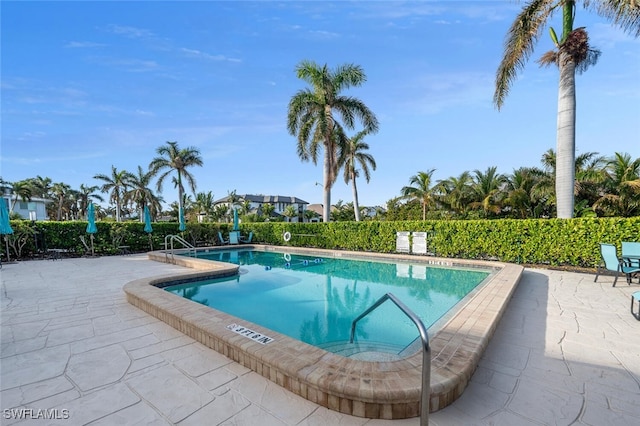 view of swimming pool featuring a patio area