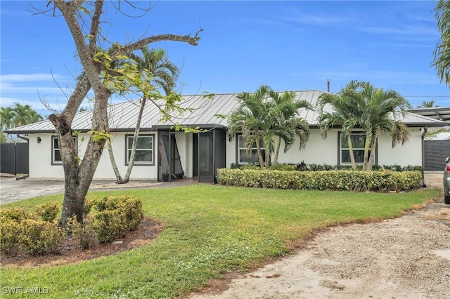 single story home with a front lawn