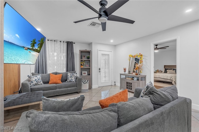 tiled living room with ceiling fan