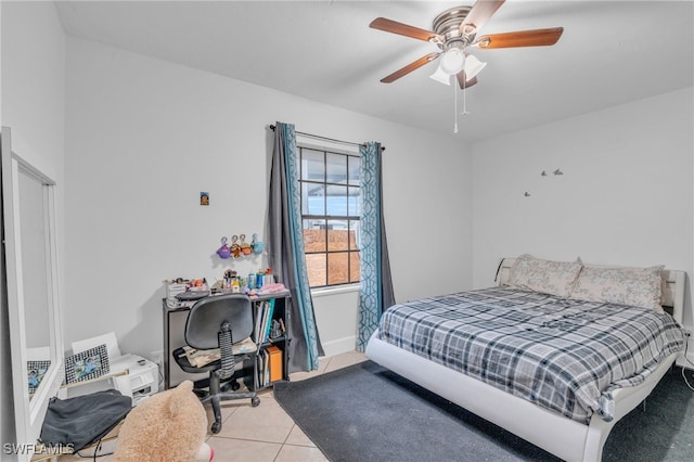 tiled bedroom featuring ceiling fan