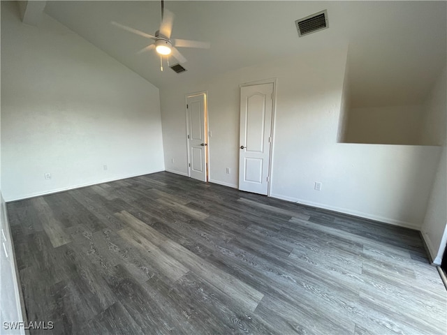 empty room with ceiling fan, dark wood-type flooring, and lofted ceiling